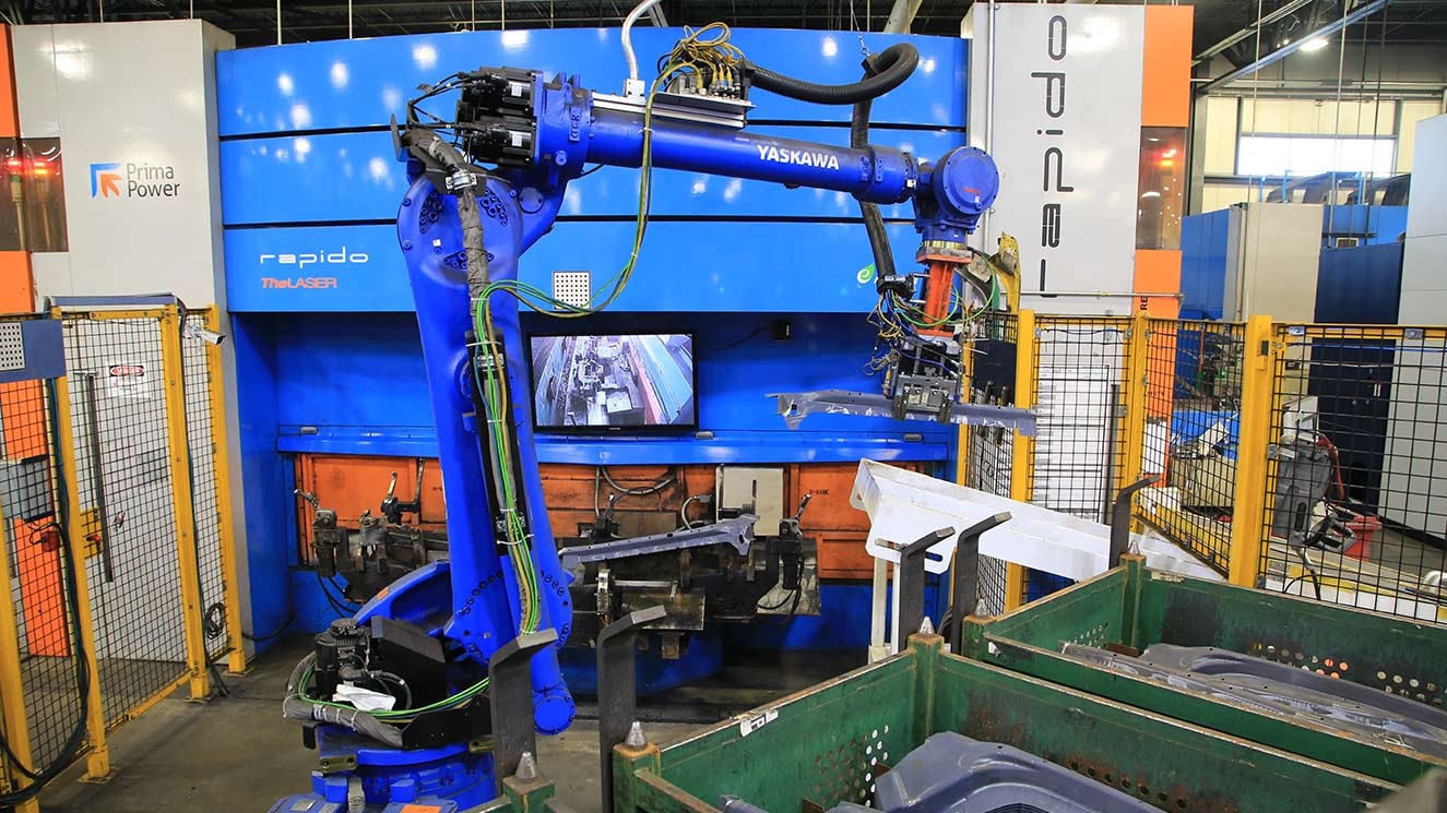 Robot moving automotive parts to bin