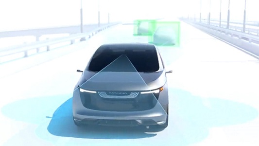 Car with sensors and showing senor capabilities driving on road