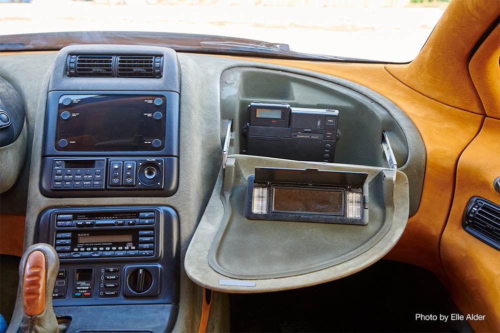 View of dashboard and opened glove compartment of the Magna Torrero