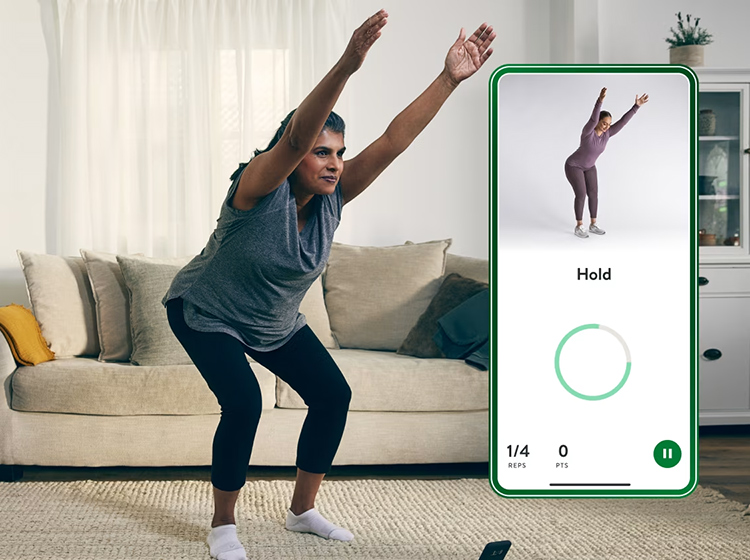 Person exercising in a room with a couch and a picture of a mobile app screen superimposed