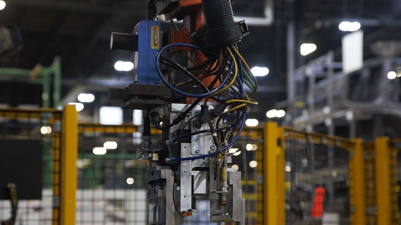 Close up of robot used to manufacture automotive parts