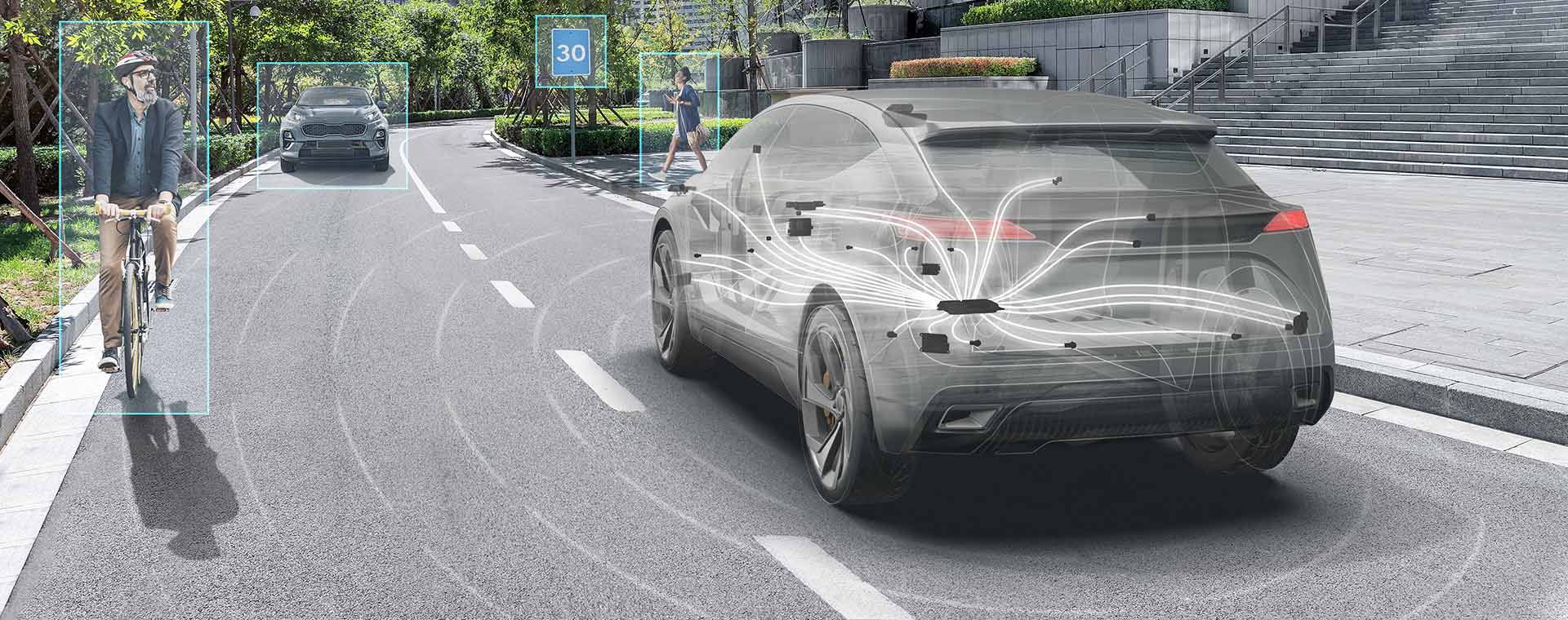 Landing_Page_Banner-01 Ghosted grey vehicle driving along a road showing all of the ADAS sensors