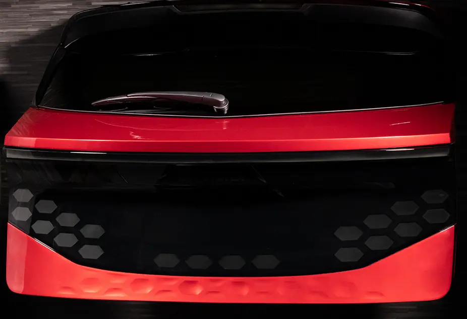 Close up of back of a black and red car
