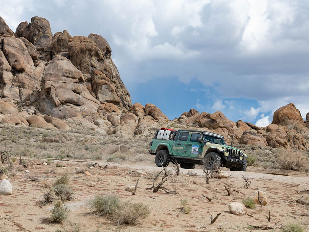 Jeep® Gladiator Rubicon driving through rugged terrain