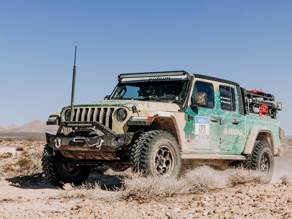 Jeep® Gladiator Rubicon driving along rugged terrain