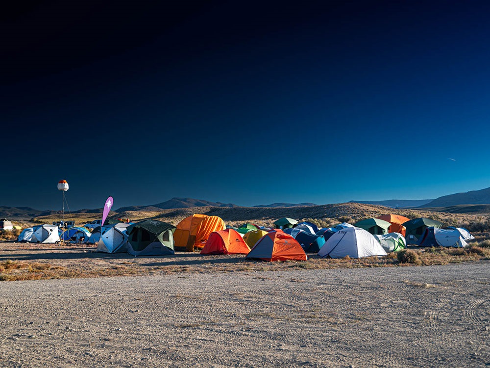 Group of tents set up in the desert for the Rebelle Rally