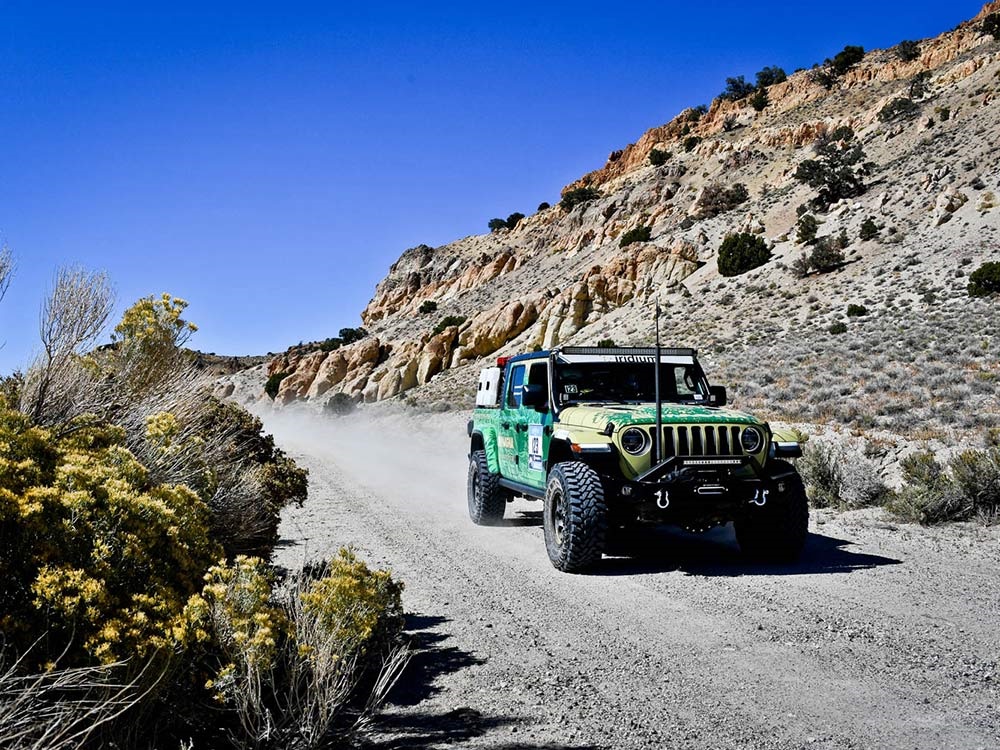 Jeep® Gladiator Rubicon driving along rugged terrain