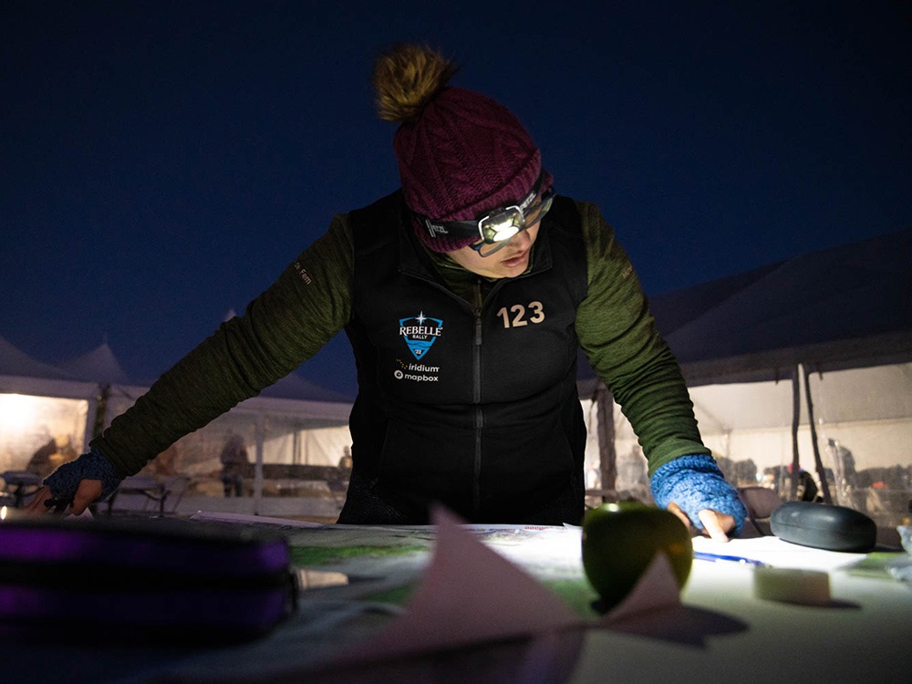 Michelle Figueroa looking at a map at night