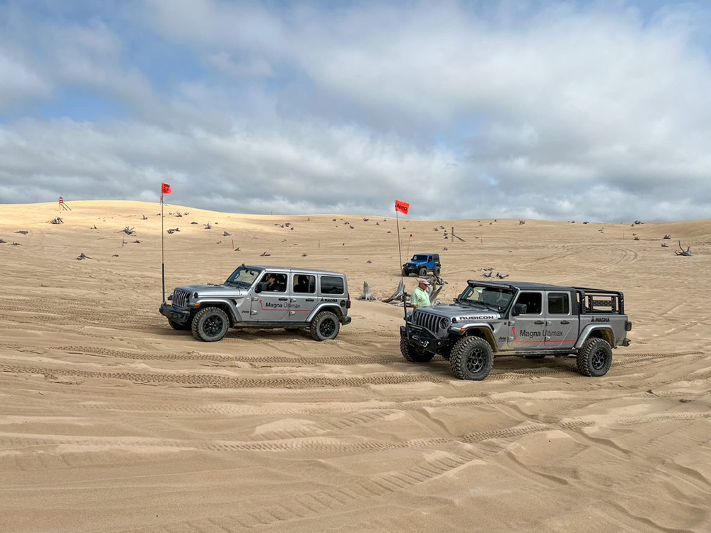 Two Jeep® Gladiator Rubicons driving along rugged terrain