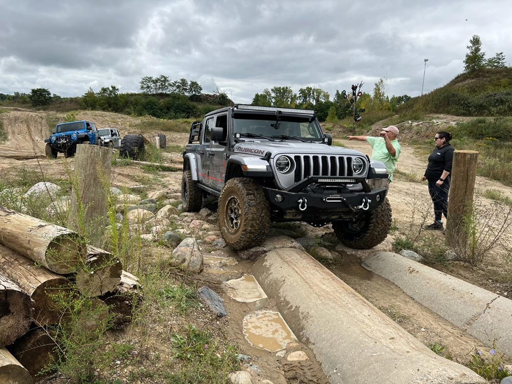 Jeep® Gladiator Rubicon driving along rugged terrain