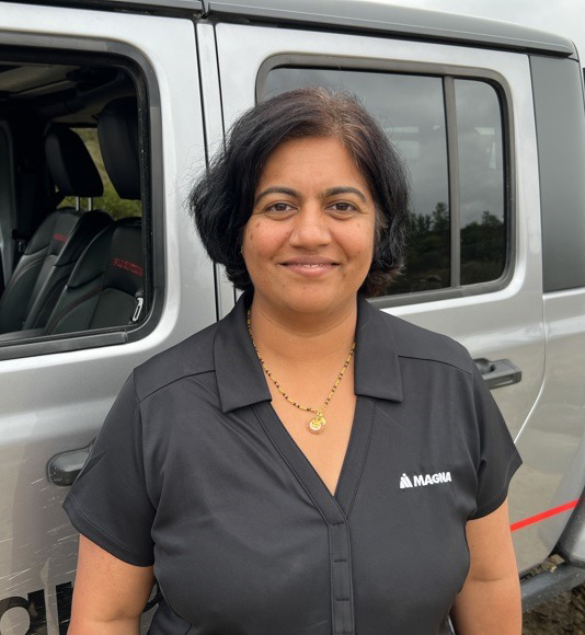 Sree Anandavally standing in front of Jeep Replicon