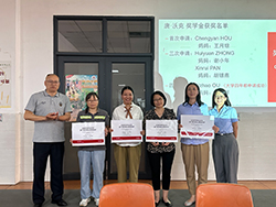 Group of people standing together holding certificates
