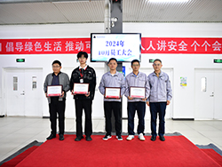 Group of people standing together holding certificates