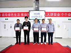 Group of people standing together holding certificates