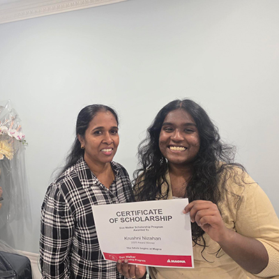 Krushni Nizahan receiving the Don Walker Scholarship Program Award
