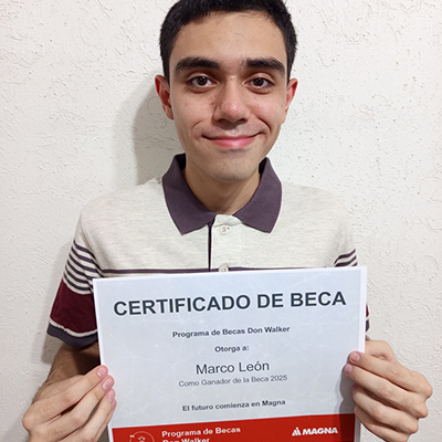 Marco Antonio Leon Quijada holding the Don Walker Scholarship Program Award