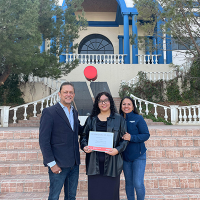 Thania Camila Villanueva Ibarra receiving the Don Walker Scholarship Program Award