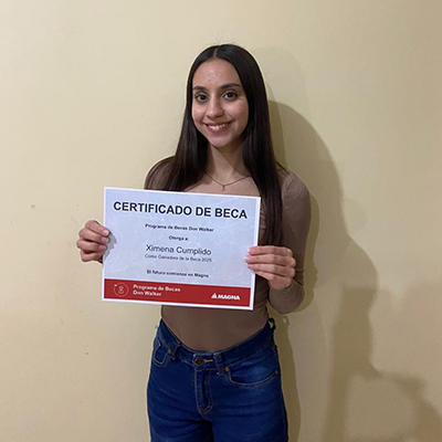 Ximena Yamileth Cumplido Valle holding the Don Walker Scholarship Program Award