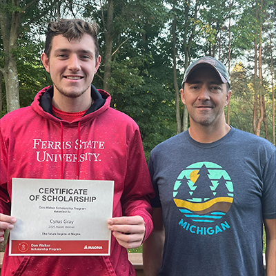 Cyrus Gray receiving the Don Walker Scholarship Program Award
