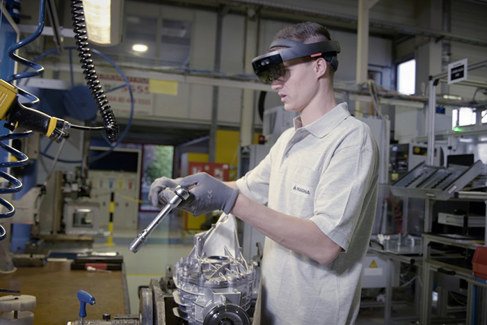 Person working in a facility making automotive parts
