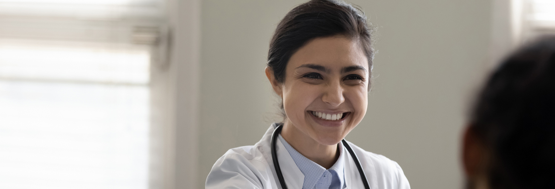 Doctor smiling at a patient