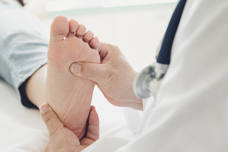 Doctor examining a person's foot