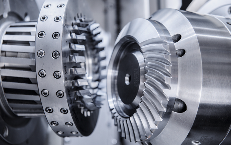 Close-up of precision metal gears in an industrial machine
