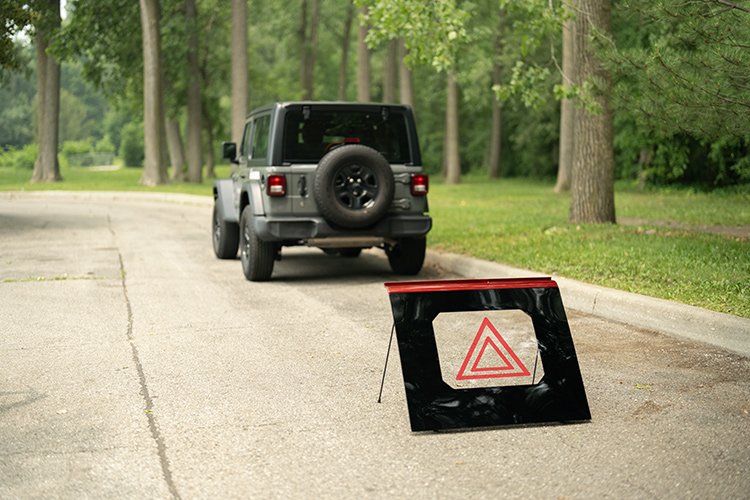 Thermoplastic roof panel that can be used as a warning sign for vehicle stopped on the side of the road