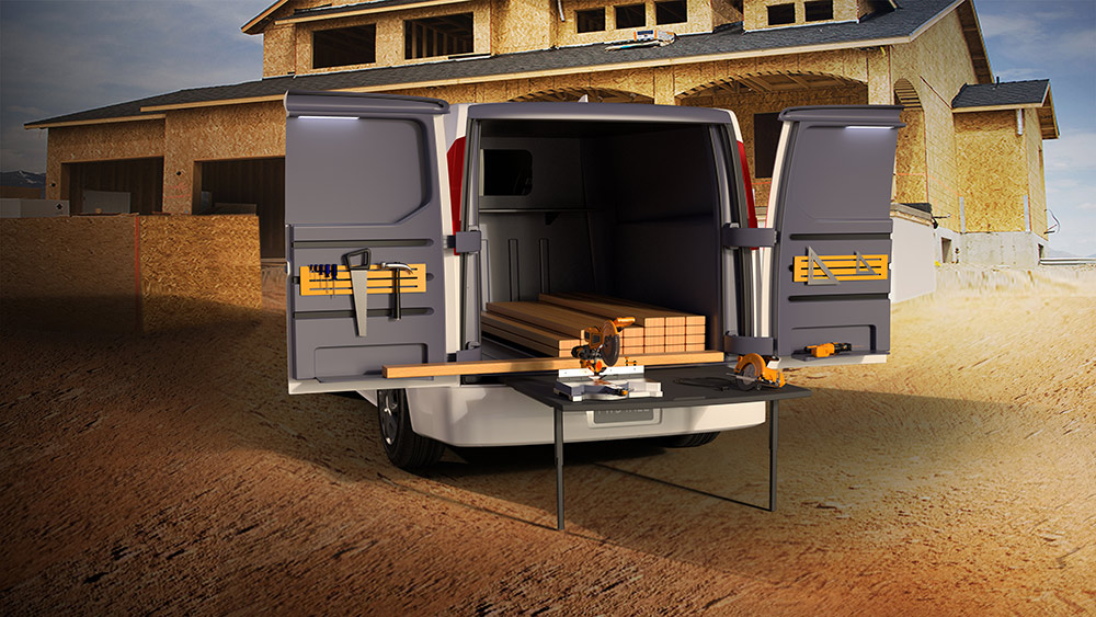 Grey van with construction materials inside, storage on doors and pullout table with the thermoplastic swing doors open