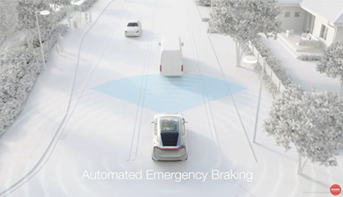 Vehicle driving along a road behind a van showing Automated Emergency Braking capability