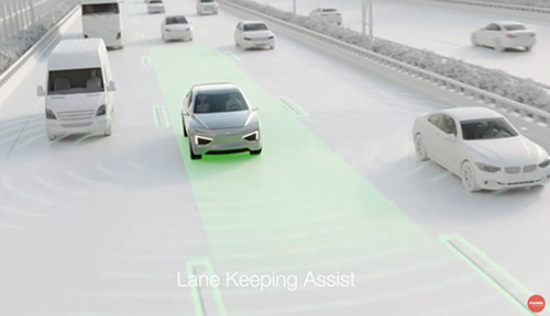 Vehicle driving down a highway showing Lane Keeping Assist capabilities