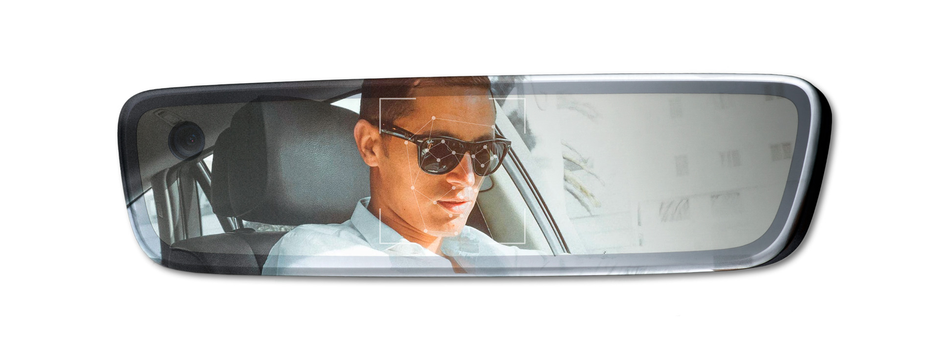 Reflection of a person in an interior mirror showing points where the driver monitoring system is monitoring the driver.