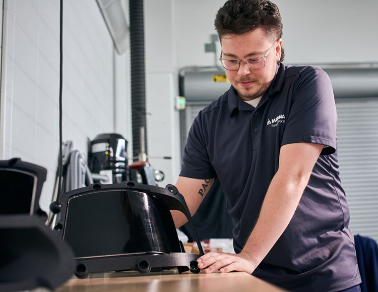 Person working with morphing surfaces technology to manufacture car parts