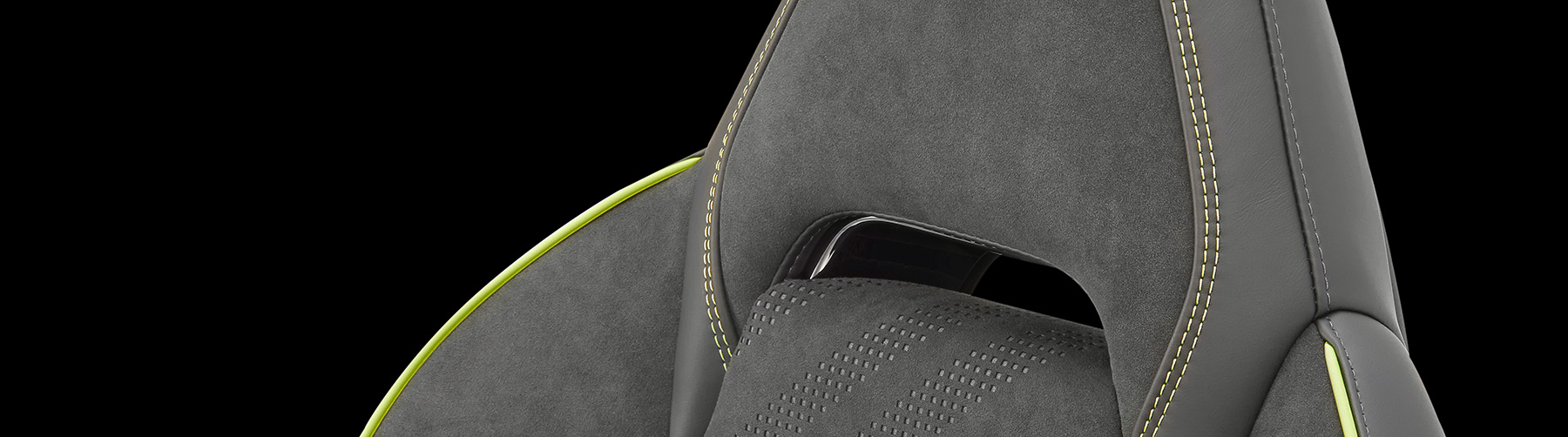 Close up of the material and trim on a head rest of a car seat