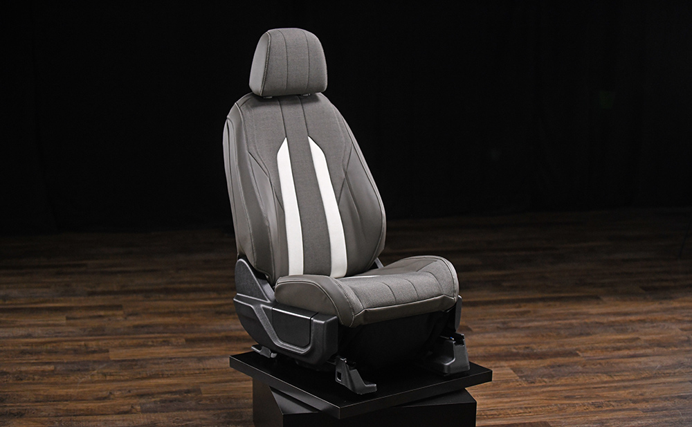Grey and white car seat manufactured with bio-based and recycled solutions