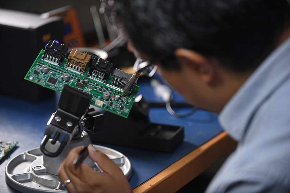 Person working with circuits and circuit board