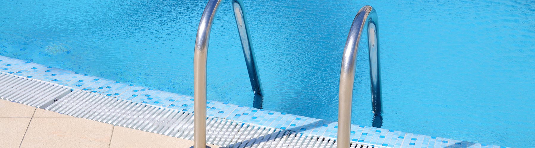 Ladder going into an outdoor pool