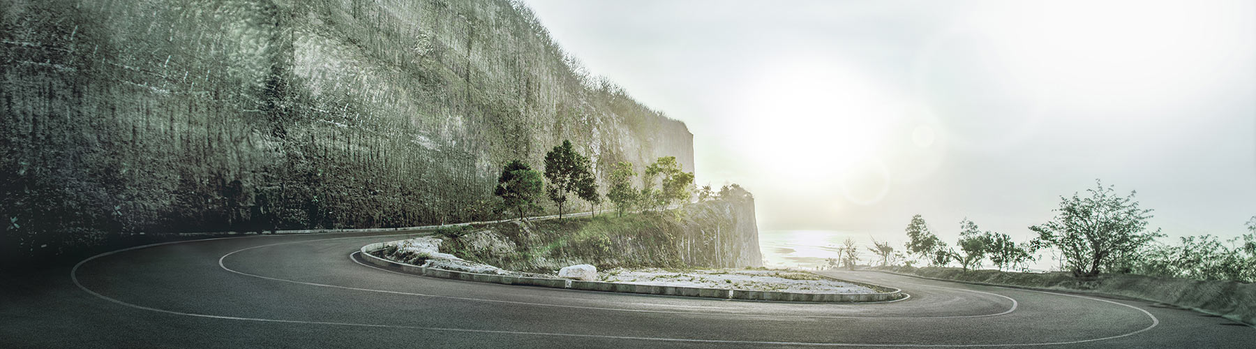Vehicle driving along a road in the desert