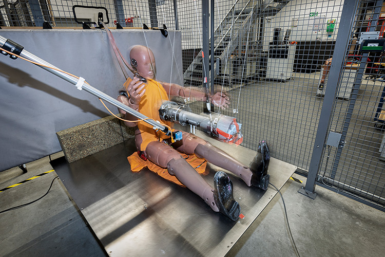 Crash Test Dummy being testing for impact on their chest