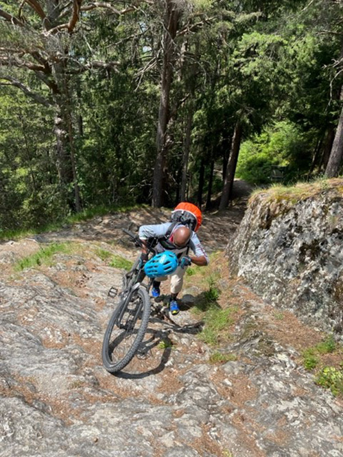 Ganda pushing the bike up a steep portion of Via Claudia Augusta