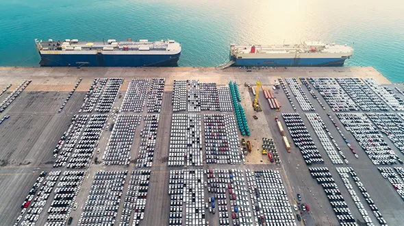 Harbour with huge parking lot and 2 boats