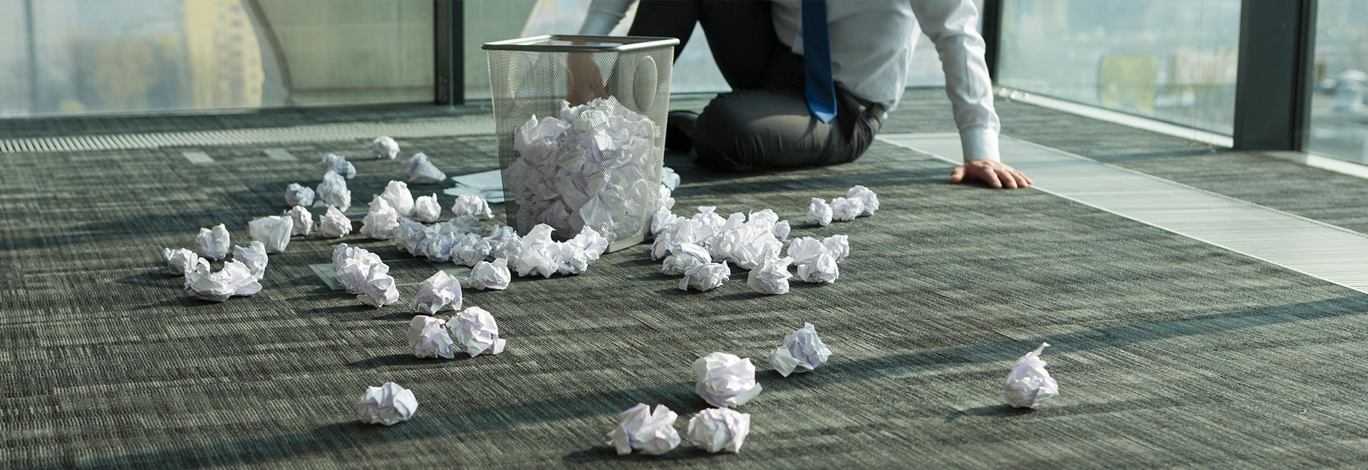 Business man sitting on the floor after failing