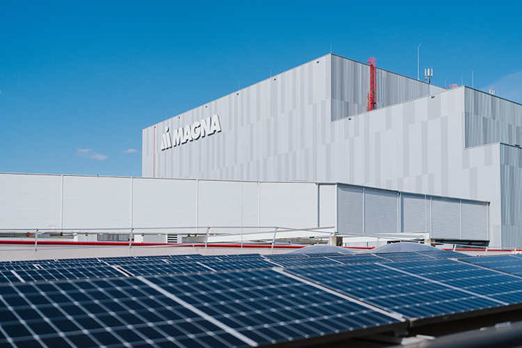 Exterior of Magna Steyr manufacturing facility with solar panels on the roof