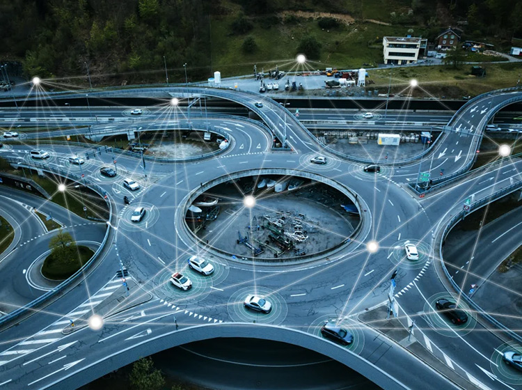 Vehicles driving on a roundabout showing how real-time sensor information can enhance safety on the road